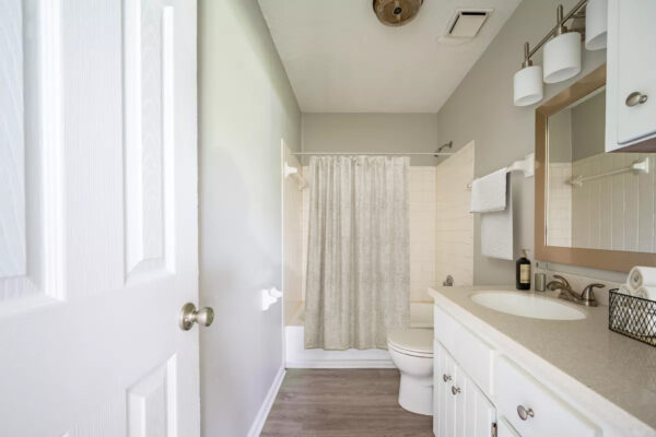 Amplio-Development-Partners-Portfolio-Skyline-Flats-bathroom-view-beige-walls-sink-counter-shower